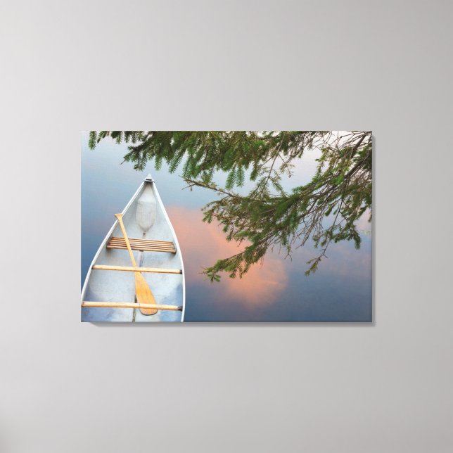 Canoe on lake at sunset, Canada Canvas Print (Front)