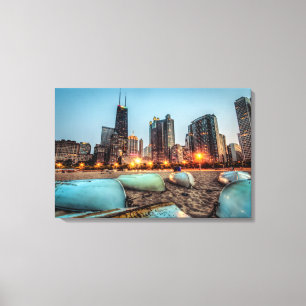 Canoes on Oak Street Beach a little after sunset Canvas Print
