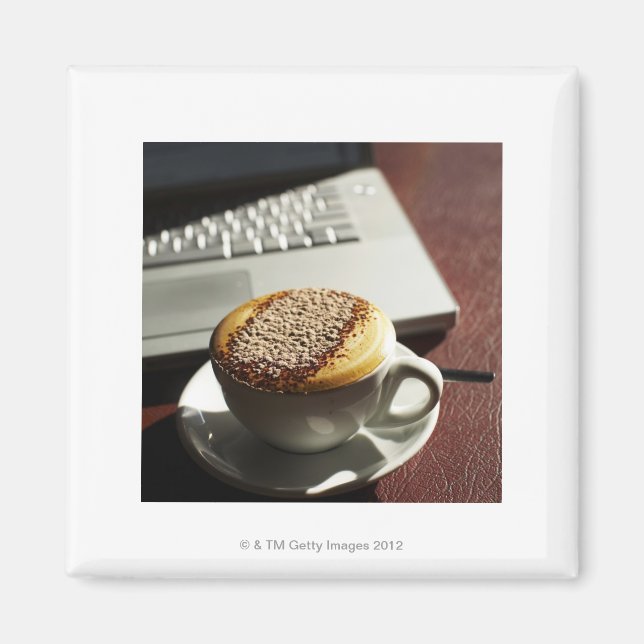 Cappuccino in front of laptop magnet (Front)