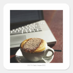 Cappuccino in front of laptop square sticker