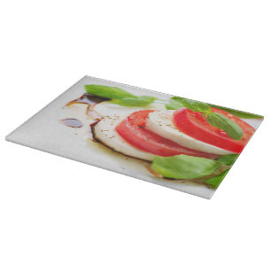Caprese Salad. Tomato and Mozzarella slices Cutting Board