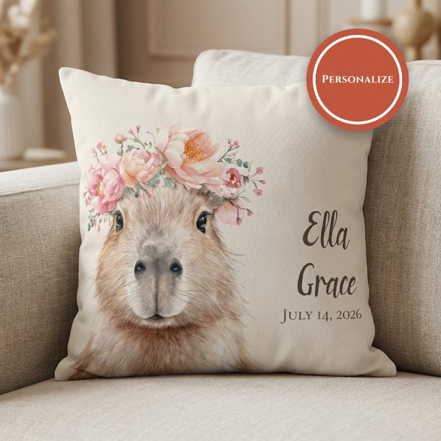 Capybara Baby Nursery • Personalized  Cushion (soft nursery pillow with floral capybara illustration on beige sofa setting)
