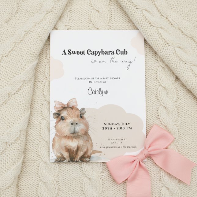 Capybara Baby Shower • Pink Bow Theme Invitation (Baby shower invitation with capybara and pink bow on cream knitted blanket, soft neutral tones.)