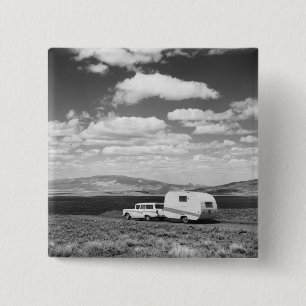 Car pulling trailer on road 15 cm square badge