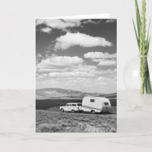 Car pulling trailer on road card