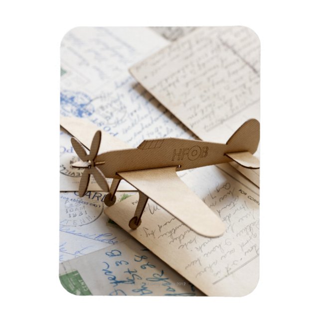Carboard aeroplane on postcards magnet (Vertical)