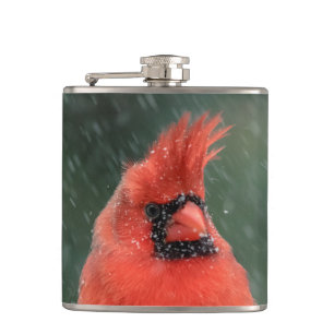 Cardinal in a pine tree during a snow storm hip flask