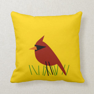 Cardinal on Grass with Bright Yellow Cushion