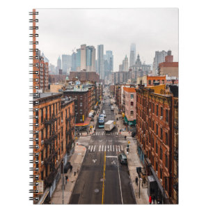 CARS ON ROAD BETWEEN HIGH RISE BUILDINGS DURING DA NOTEBOOK