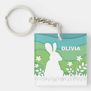 Cartoon easter bunny in green spring nature key ring
