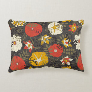 cartoon leaves and flowers on a dark background in decorative cushion