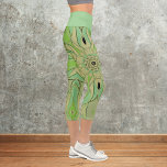 Cartoon Mandala Flower Green and Blue Capri Leggings<br><div class="desc">This funky mandala flower design features green and blue in a cartoon style. Trippy geometric visuals for the modern hippie or lover of vibrant colours!</div>