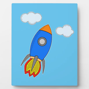 Cartoon Rocket In Blue Sky Plaque