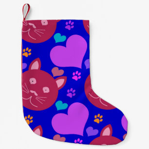 Cartoon style seamless wallpaper with cat face and small christmas stocking