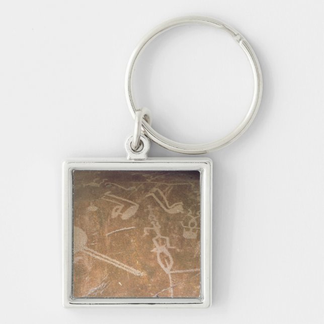 Carved petroglyph depicting figures key ring (Front)