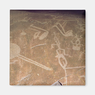 Carved petroglyph depicting figures magnet
