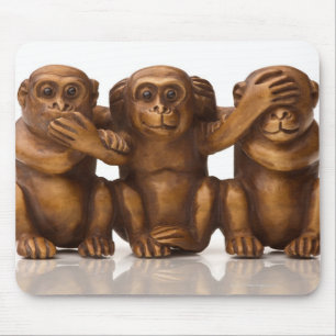 Carving of three wooden monkeys mouse pad