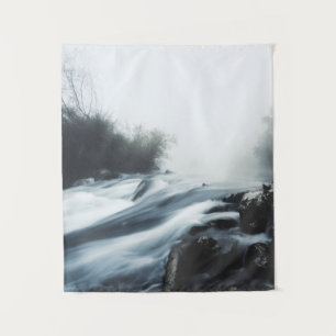 Cascade waterfall on foggy mystical morning tapestry