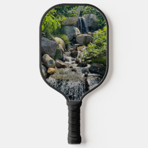 Cascading forest waterfall forest greenery pickleball paddle