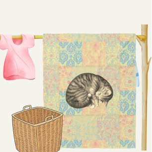 Cat curled up sleeping on quilt cute cosy fleece blanket