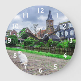 Cat in traditional fishing village large clock