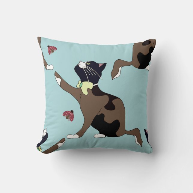 Cat with a bow catches a ladybug. cushion (Front)