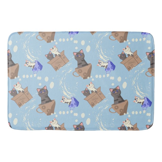 Cats in box and milk drops on blue bath mat (Front)