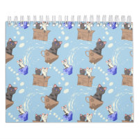 Cats in box and milk drops on blue