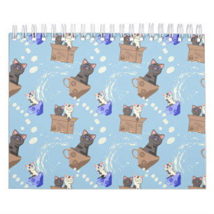 Cats in box and milk drops on blue calendar