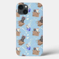 Cats in box and milk drops on blue