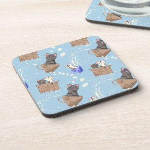 Cats in box and milk drops on blue coaster