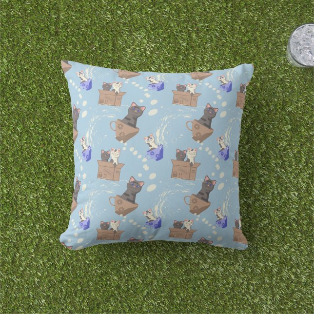 Cats in box and milk drops on blue cushion (Grass)
