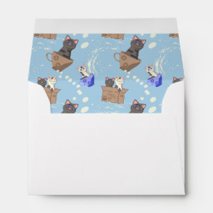 Cats in box and milk drops on blue envelope