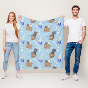 Cats in box and milk drops on blue fleece blanket