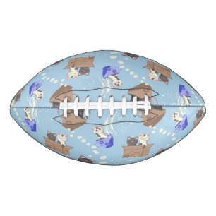 Cats in box and milk drops on blue football