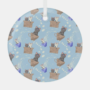 Cats in box and milk drops on blue glass tree decoration