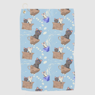 Cats in box and milk drops on blue golf towel