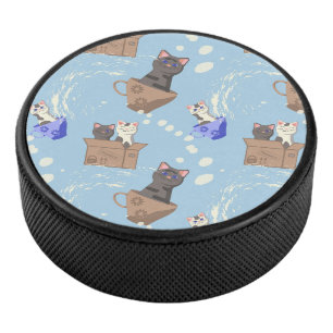 Cats in box and milk drops on blue hockey puck