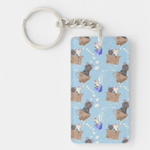 Cats in box and milk drops on blue key ring