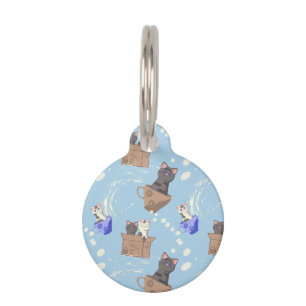Cats in box and milk drops on blue pet tag