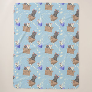 Cats in box and milk drops on blue sherpa blanket