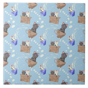 Cats in box and milk drops on blue tile