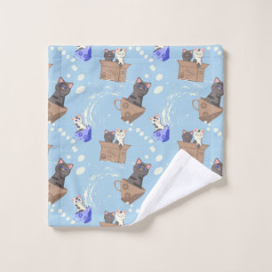 Cats in box and milk drops on blue wash cloth