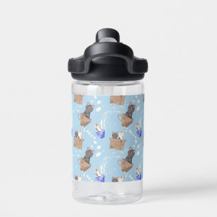 Cats in box and milk drops on blue water bottle