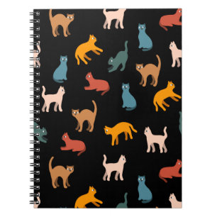 Cats on the black notebook
