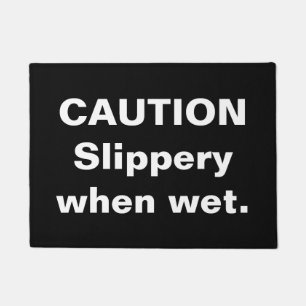 Caution. Slippery when wet. Doormat