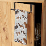 Cavalier King Charles Spaniel Paws and Bones Tea Towel<br><div class="desc">Cute Cavalier King Charles Spaniel with black,  brown and white coats with scattered dog bones and pawprints pattern.</div>