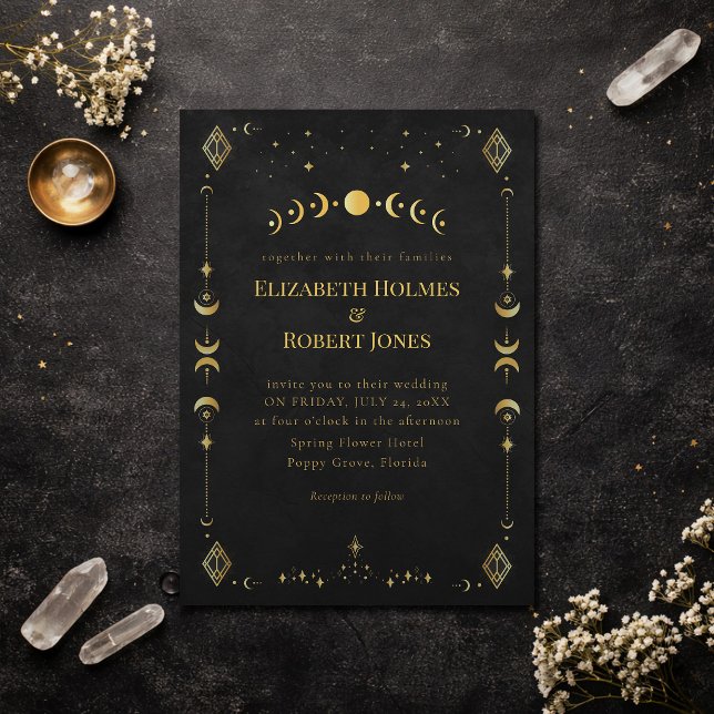 Celestial Gothic Black and Gold Wedding Invitation (Celestial Gothic Black and Gold Wedding Invitation on a dark elegant table with dry flowers)