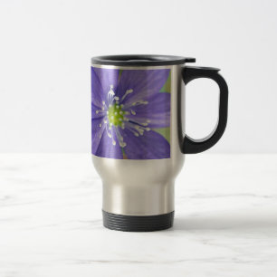 Centre of a blue flower with white stamps travel mug