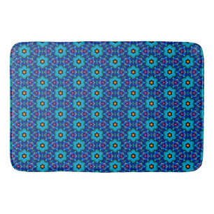 Cerulean and orange flowers in a Purple bk Bath Mat